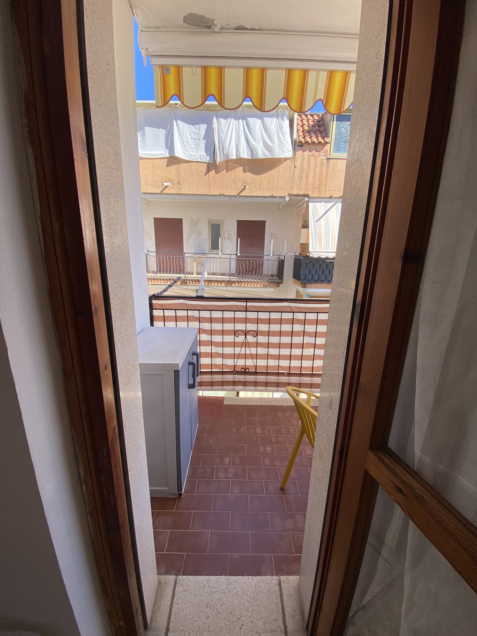 Sunny balcony with outdoor seating