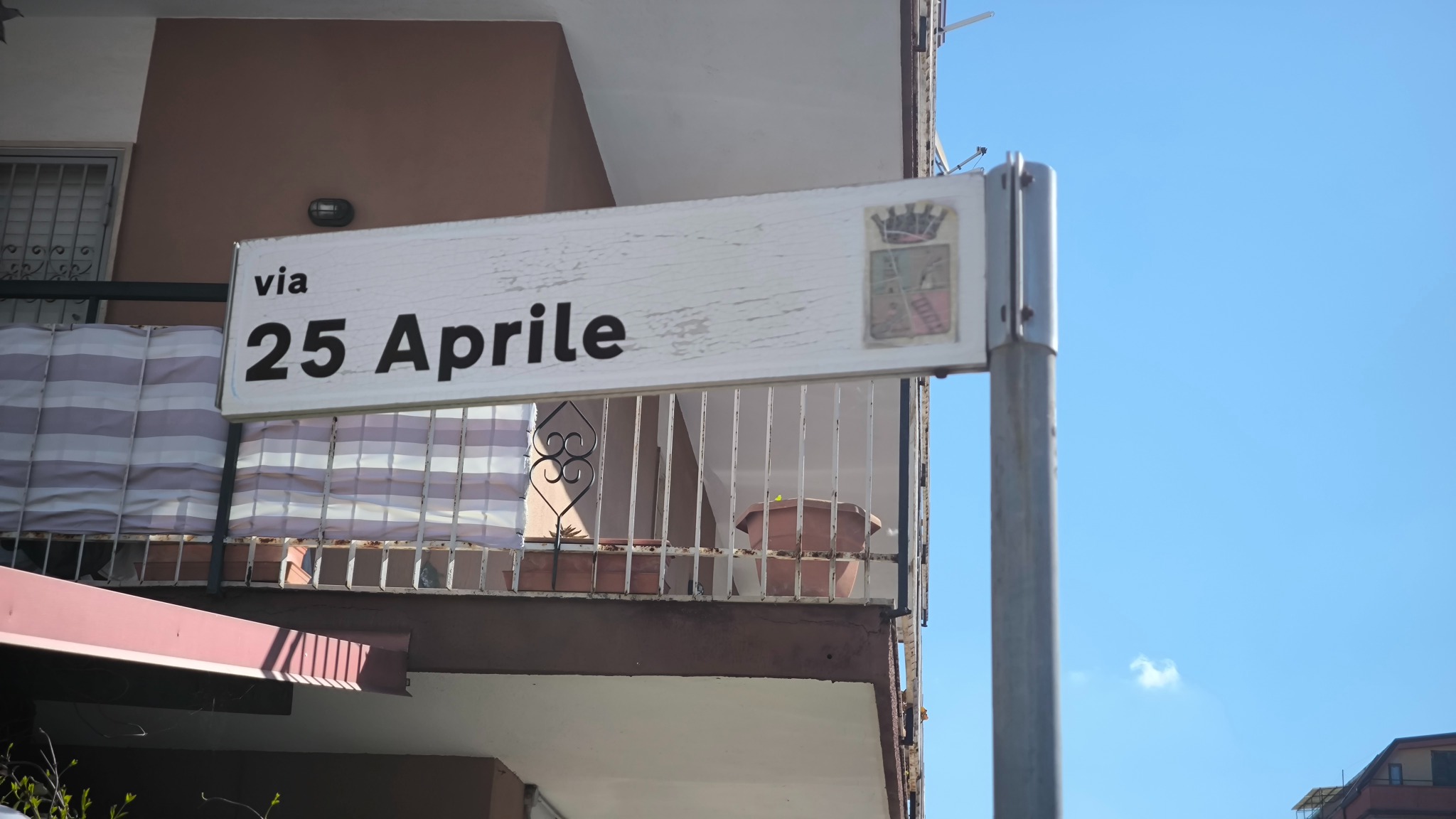 Via 25 Aprile street sign near the apartment